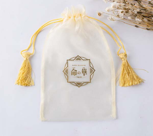 white organza jewelry pouch with pink silk ribbon drawstring rope